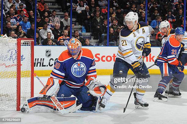 Ben Scrivens of the Edmonton Oilers makes a save on a shot from Drew Stafford of the Buffalo Sabres on March 20, 2014 at Rexall Place in Edmonton,...