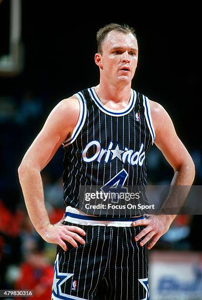 Scott Skiles of the Orlando Magic looks on against the Washington Bullets during an NBA basketball game circa 1991 at the Capital Centre in Landover,...