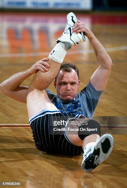 Scott Skiles of the Orlando Magic stretches prior to the start of an NBA basketball game against the Washington Bullets circa 1991 at the Capital...