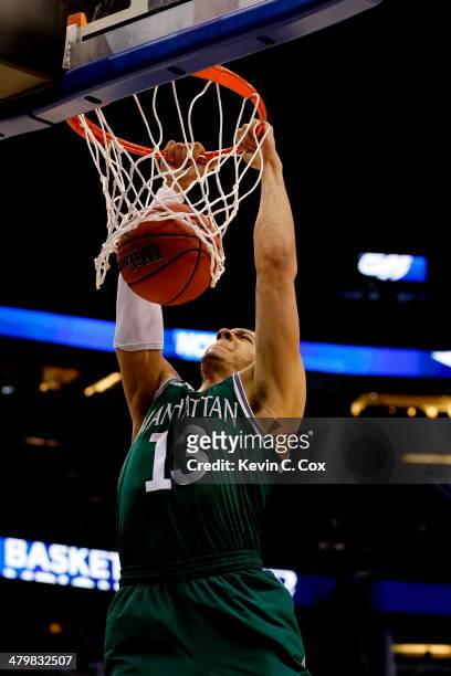 Emmy Andujar of the Manhattan Jaspers dunks the ball against the Louisville Cardinals in the second half during the second round of the 2014 NCAA...