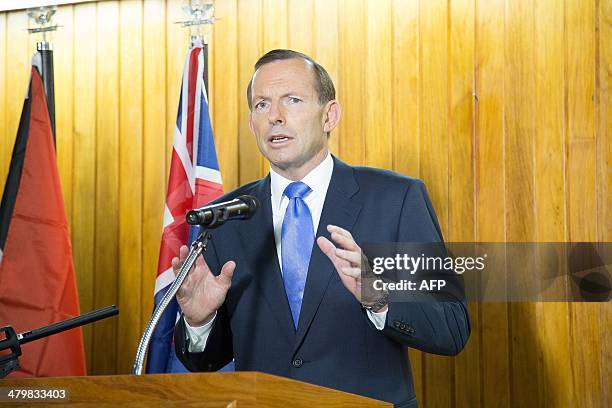 Australian Prime Minister Tony Abbott speaks at a joint press conference with Papua New Guinea's Prime Minister Peter O'Neill in Port Moresby on...