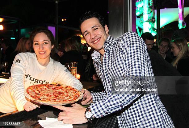 Marvin Herzsprung and Giulia of H'ugo's Pizza attend the 30 year anniversary celebration of the club P1 on March 20, 2014 in Munich, Germany.