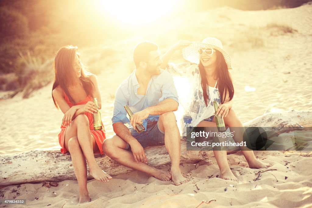 Young people having fun at beach party