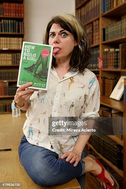 Author Caitlin Moran signs copies of her book "How To Build A Girl" at Strand Bookstore on July 7, 2015 in New York City.