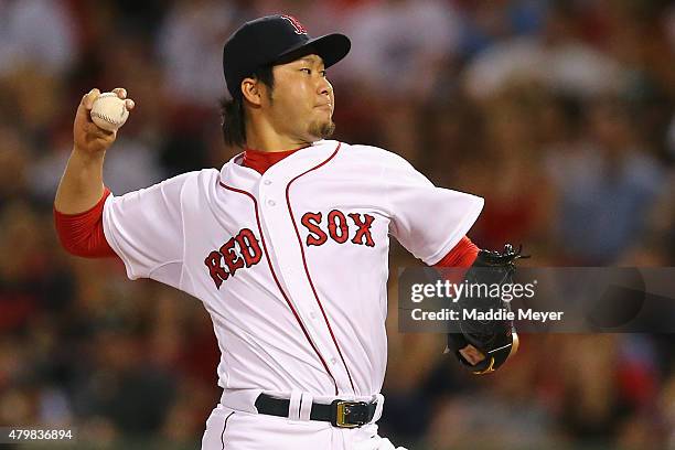 Junichi Tazawa of the Boston Red Sox pitches against the Miami Marlins during the eighth inning at Fenway Park on July 7, 2015 in Boston,...