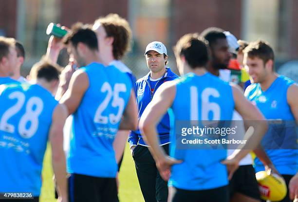Brad Scott, coach of the Kangaroos looks on during a North Melbourne Kangaroos AFL training session at Arden Street Ground on July 8, 2015 in...