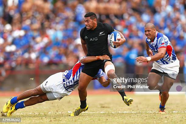 Charles Piutau of the New Zealand All Blacks is tackled during the International Test match between Samoa and the New Zealand All Blacks at Apia...