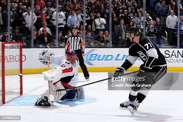 Jeff Carter of the Los Angeles Kings shoots and scores during the shootout against Jaroslav Halak of the Washington Capitals at Staples Center on...