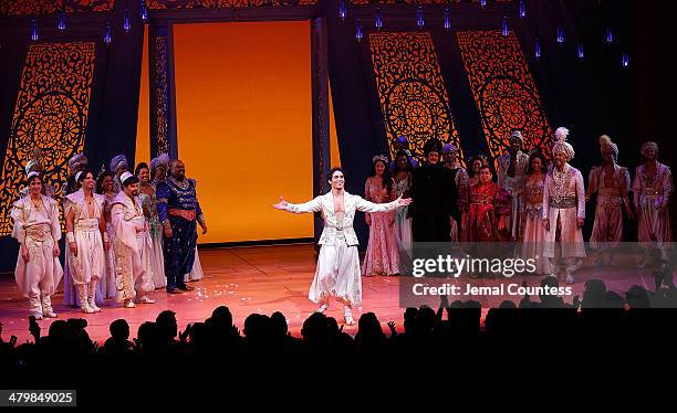 Actor Adam Jacobs takes a bow during curtain call at the the "Aladdin" On Broadway Opening Night at New Amsterdam Theatre on March 20, 2014 in New...