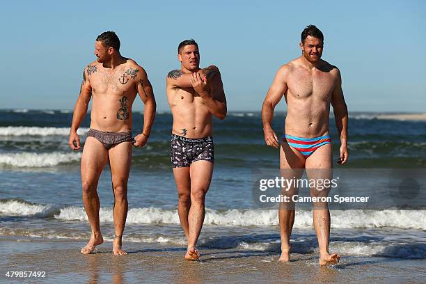 Scott Higginbotham, Sean McMahon and James Horwill of the Wallabies walk out of the water at Shelly Beach during an Australian Wallabies recovery...