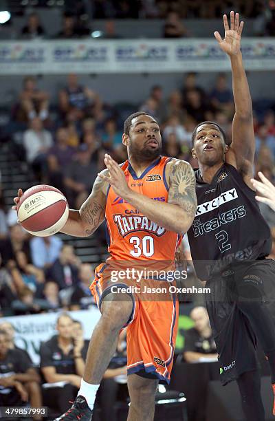 Demetri McCamey of the Taipans is under pressure from Kerron Johnson during the round 23 NBL match between the New Zealand Breakers and the Cairns...