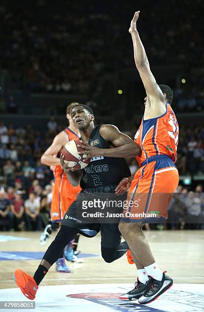 Kerron Johnson of the Breakers is under pressure from Demetri McCamey of the Taipans during the round 23 NBL match between the New Zealand Breakers...