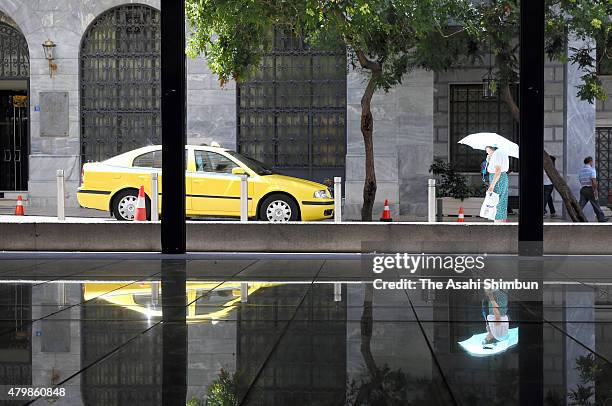 Pensioner outside a National Bank of Greece branch on July 7, 2015 in Athens, Greece. Greek Prime Minister Alexis Tsipras is working on new debt...