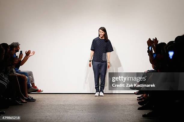 Designer William Fan poses at the William Fan show during the Mercedes-Benz Fashion Week Berlin Spring/Summer 2016 at Stage at me Collectors Room on...