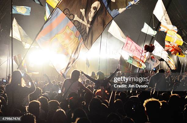 General view of the flags and crowd in front of the Pyramid stage as Kanye West performs live during the second day of Glastonbury Festival at Worthy...