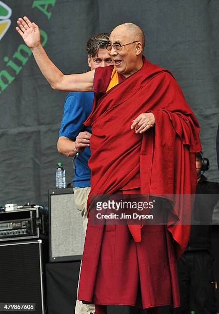 His holiness the Dalai Lama joins Patti Smith on the Pyramid stage during the third day of the Glastonbury Festival at Worthy Farm, Pilton on June...