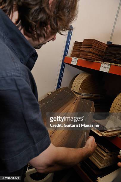 British luthier Patrick James Eggle selects pieces of wood at his workshop in Oswestry, photographed during a shoot for Guitarist Magazine/Future via...