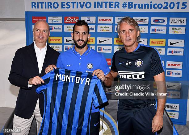 Managing Director and COO Marco Fassone, Martin Montoya and Head coach Roberto Mancini pose for a photo during a press conference at Riscone di...