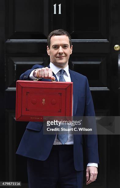 The Chancellor of the Exchequer George Osborne holds his ministerial red box up to the media as he leaves 11 Downing Street on July 8, 2015 in...