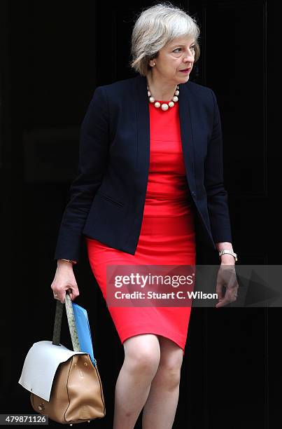 Home secretary Theresa May departs 10 Downing street prior to The Chancellor of the Exchequer George Osborne holding his ministerial red box up to...