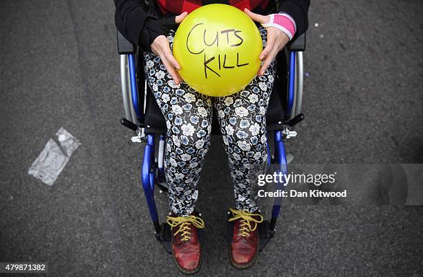 Anti austerity protesters prepare to throw balls towards Downing Street after the Chancellor of the Exchequer George Osborne left 11 Downing Street...