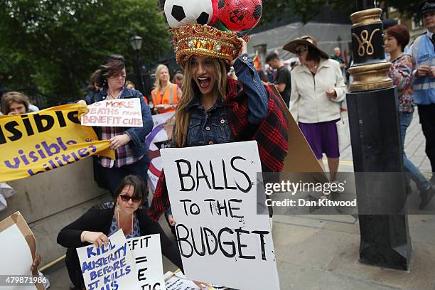 Anti austerity protesters gather outside Downing Street as the Chancellor of the Exchequer George Osborne left 11 Downing Street on July 8, 2015 in...