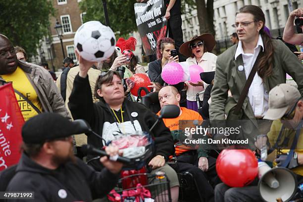 Anti austerity protesters gather outside Downing Street as the Chancellor of the Exchequer George Osborne left 11 Downing Street on July 8, 2015 in...