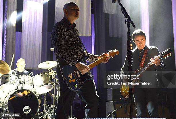 Jimmy Chamberlin, Billy Corgan, and Jeff Schroeder of The Smashing Pumpkins perform during the band's "The End Times Tour" at Concord Pavilion on...