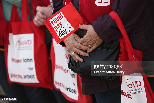 Demonstrators attend the 'Equal Pay Day' demonstration on March 21, 2014 in Berlin, Germany. The annual event recognizes the wage gap between the...