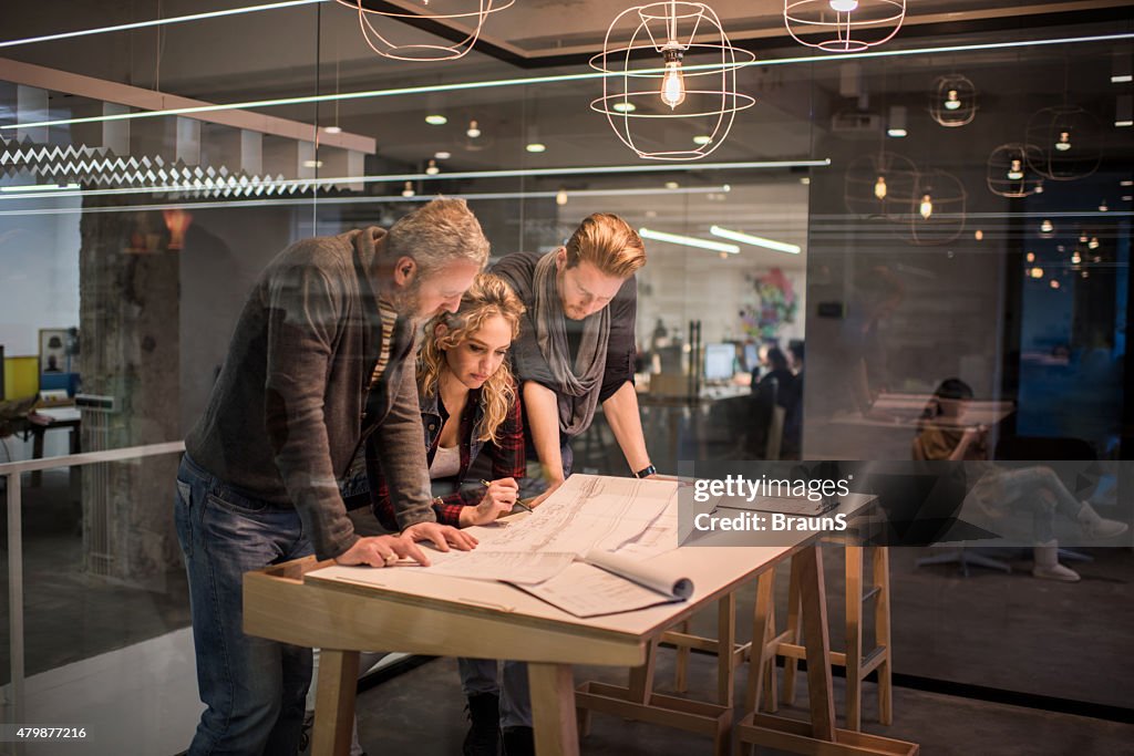 Team of architects working on a new business projects.