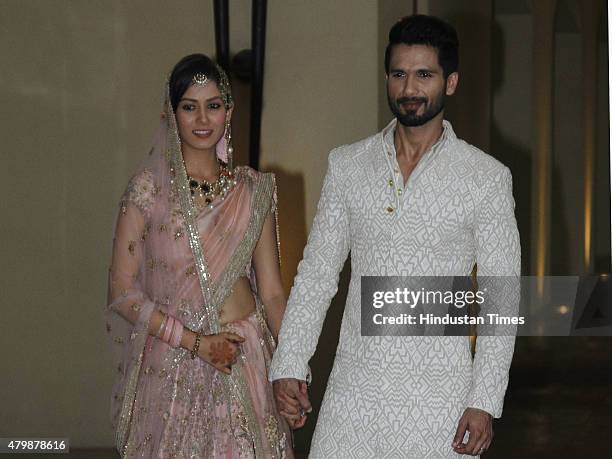 Newlywed couple of Bollywood, actor Shahid Kapoor and Mira Rajput pose for their first photo op post wedding at Hotel Trident on July 7, 2015 in...