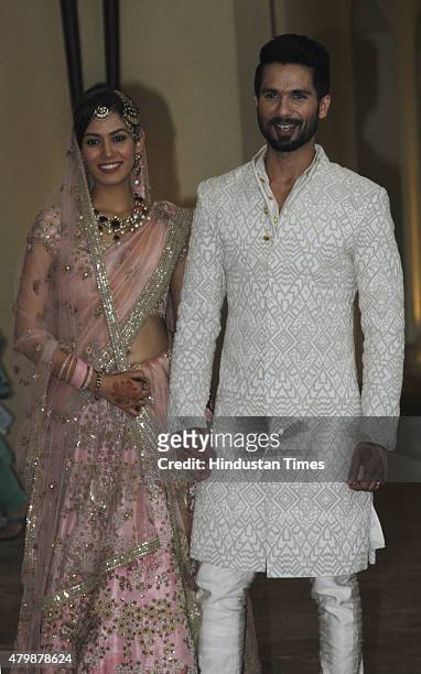Newlywed couple of Bollywood, actor Shahid Kapoor and Mira Rajput pose for their first photo op post wedding at Hotel Trident on July 7, 2015 in...