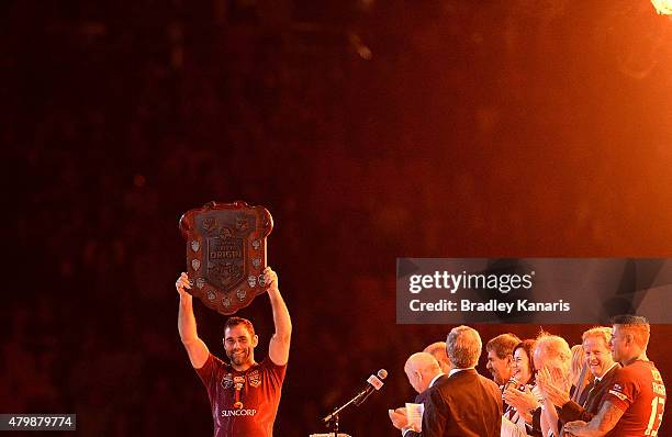 Cameron Smith of the Maroons holds up the winners shield after game three of the State of Origin series between the Queensland Maroons and the New...