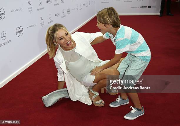 Xenia Seeberg and her son attend the Minx by Eva Lutz show during the Mercedes-Benz Fashion Week Berlin Spring/Summer 2016 at Brandenburg Gate on...