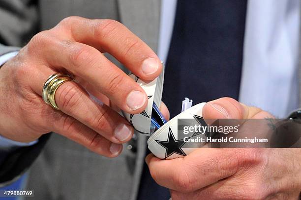 Champions League draw ball is opened during the UEFA Champions League 2013/14 season quarter-finals draw at the UEFA headquarters, The House of...