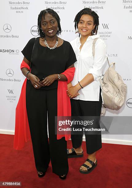 Auma Obama and Akini Obama attend the Minx by Eva Lutz show during the Mercedes-Benz Fashion Week Berlin Spring/Summer 2016 at Brandenburg Gate on...