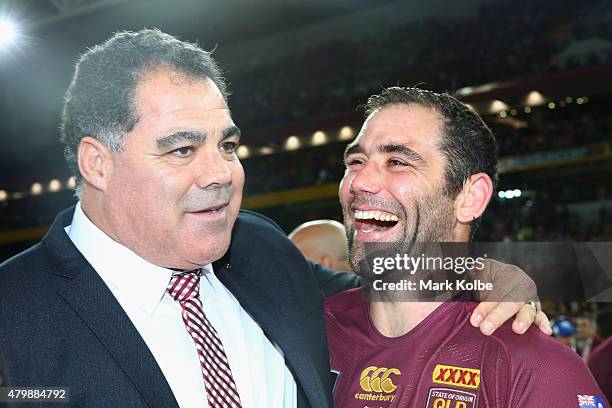 Maroons coach Mal Meninga and Maroons captain Cameron Smith of the Maroons celebrate victory during game three of the State of Origin series between...