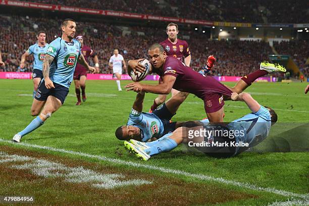 Will Chambers of the Maroons scores a try during game three of the State of Origin series between the Queensland Maroons and the New South Wales...