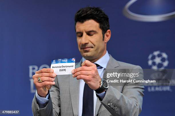 Ambassador for the final Luis Figo draws Borussia Dortmund during the UEFA Champions League 2013/14 season quarter-finals draw at the UEFA...