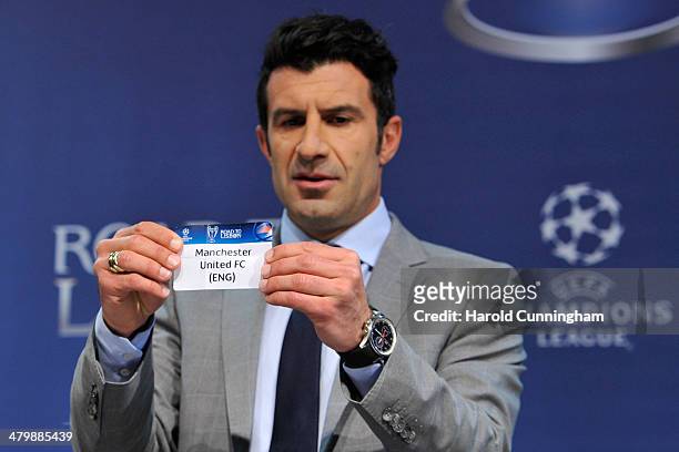 Ambassador for the final Luis Figo draws Manchester United FC during the UEFA Champions League 2013/14 season quarter-finals draw at the UEFA...