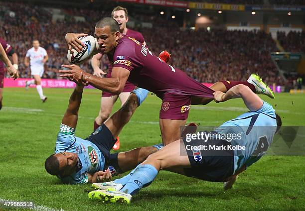 Will Chambers of the Maroons scores a try during game three of the State of Origin series between the Queensland Maroons and the New South Wales...