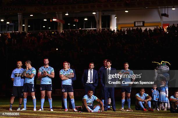 Blues coach Laurie Daley and his players look dejected after losing game three of the State of Origin series between the Queensland Maroons and the...