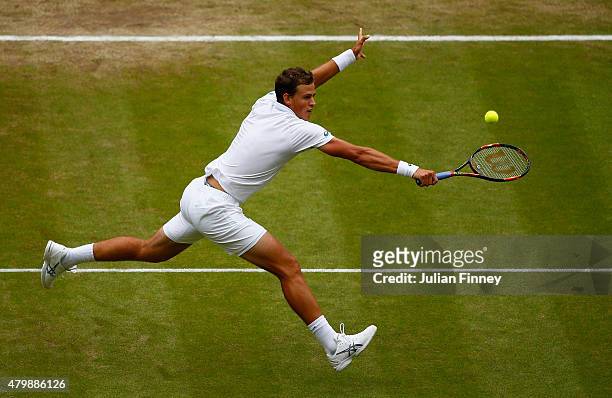 Vasek Pospisil of Canada plays a backhand in his Gentlemens Singles Quarter Final match against Andy Murray of Great Britain during day nine of the...