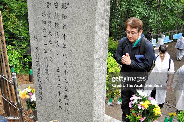 Japan Airlines employees pray for the victims of JAL 123 as they climb Mount Osutaka to remember the crash on July 8, 2015 in Ueno, Gunma, Japan....