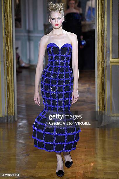 Model walks the runway during the Ulyana Sergeenko show as part of Paris Fashion Week Haute Couture Fall/Winter 2015/2016 on July 5, 2015 in Paris,...