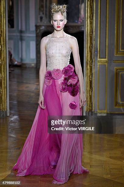 Model walks the runway during the Ulyana Sergeenko show as part of Paris Fashion Week Haute Couture Fall/Winter 2015/2016 on July 5, 2015 in Paris,...