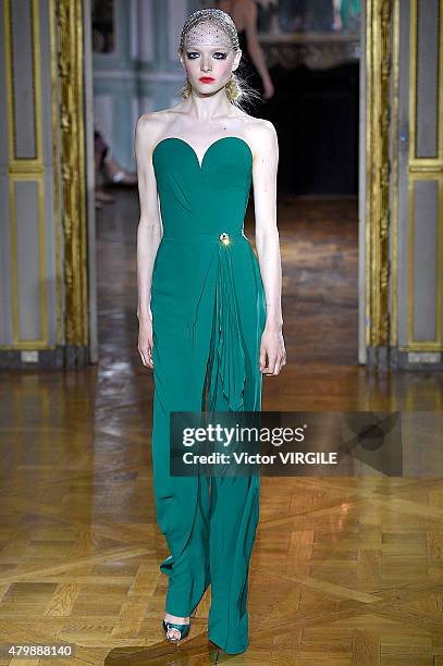 Model walks the runway during the Ulyana Sergeenko show as part of Paris Fashion Week Haute Couture Fall/Winter 2015/2016 on July 5, 2015 in Paris,...