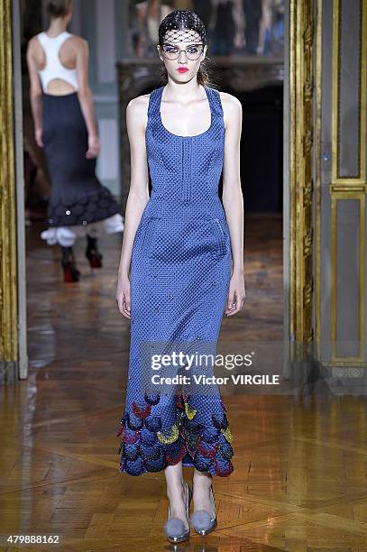 Model walks the runway during the Ulyana Sergeenko show as part of Paris Fashion Week Haute Couture Fall/Winter 2015/2016 on July 5, 2015 in Paris,...