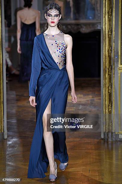 Model walks the runway during the Ulyana Sergeenko show as part of Paris Fashion Week Haute Couture Fall/Winter 2015/2016 on July 5, 2015 in Paris,...