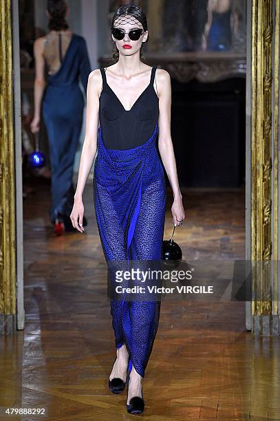 Model walks the runway during the Ulyana Sergeenko show as part of Paris Fashion Week Haute Couture Fall/Winter 2015/2016 on July 5, 2015 in Paris,...